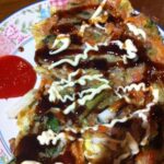 Vegetable Pancake with tonkatsu sauce and mayo with chili sauce