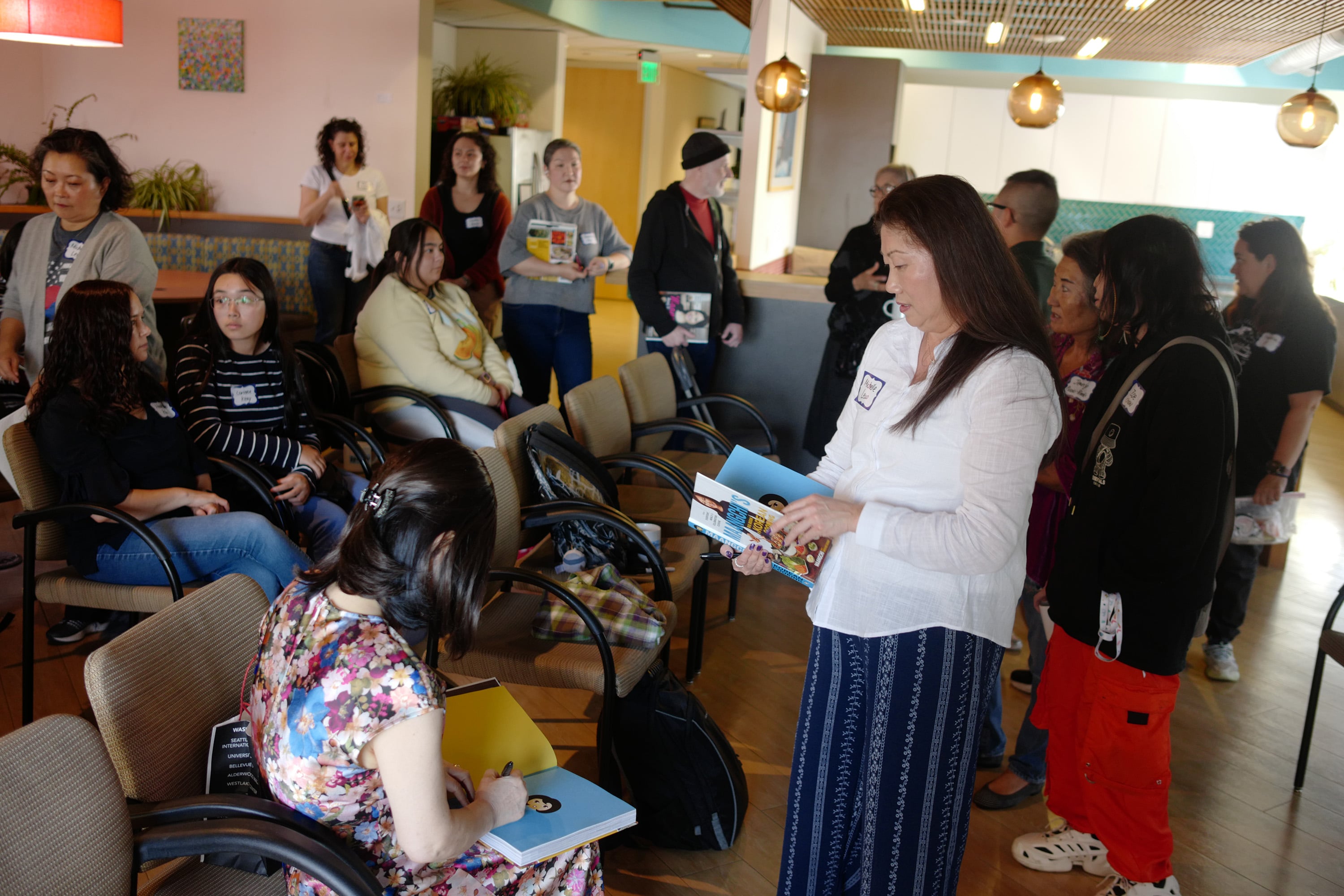 Signing cookbooks at the Seattle meetup